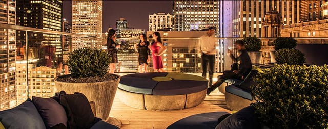 Cerise Rooftop at Virgin Hotels Chicago, vibrant event space with city skyline backdrop.