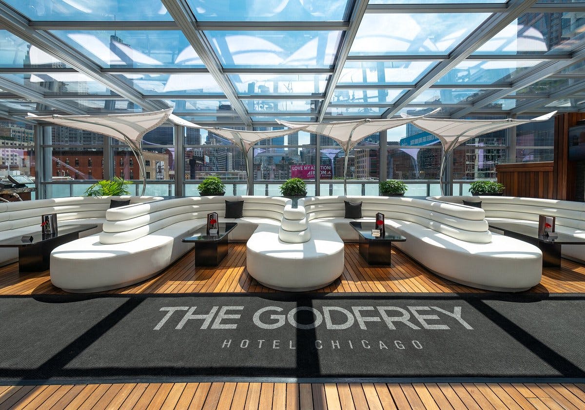 Rooftop Lounge at The Godfrey Hotel Chicago, modern event space with glass ceiling, ideal for receptions.