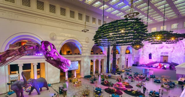 Stanley Field Hall at Field Museum, elegant event space with dramatic decor and sculptures.