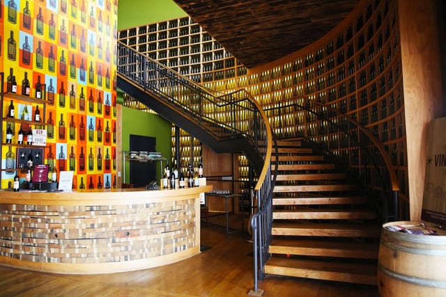 Cellar Room at City Winery Chicago: modern bar, elegant staircase, perfect for events.