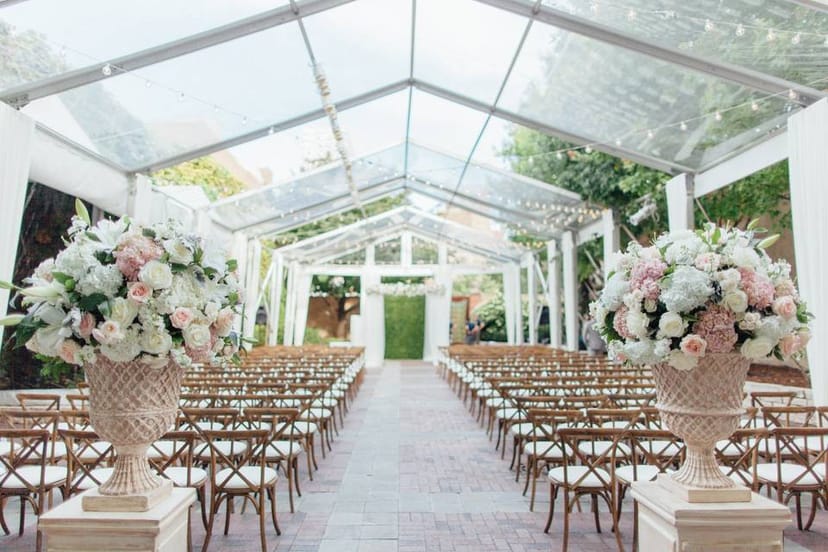 Tented outdoor event space in Chicago with floral decor, perfect for weddings.