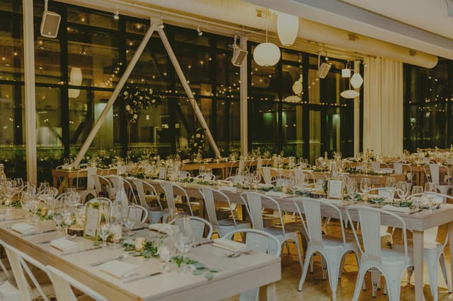 Elegant event space with long tables, ideal for meetings and galas at Greenhouse Loft.