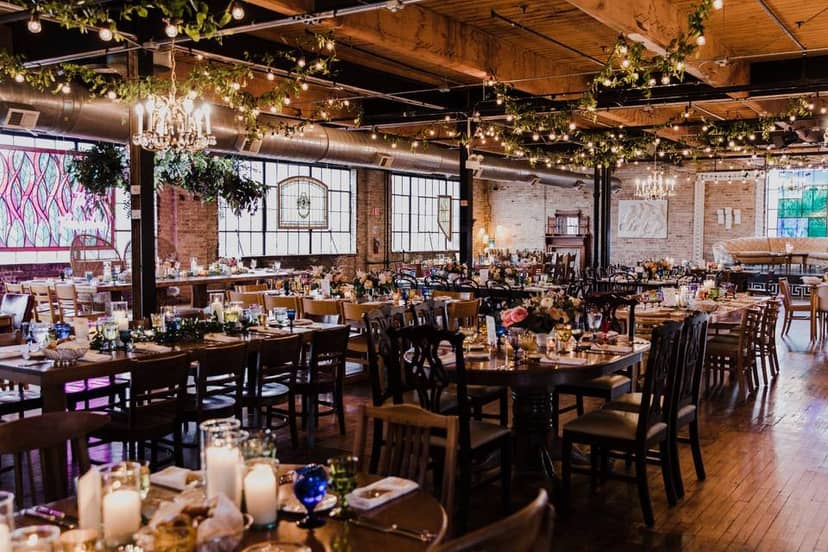 Rustic event space with wooden beams, ideal for weddings and formal gatherings.