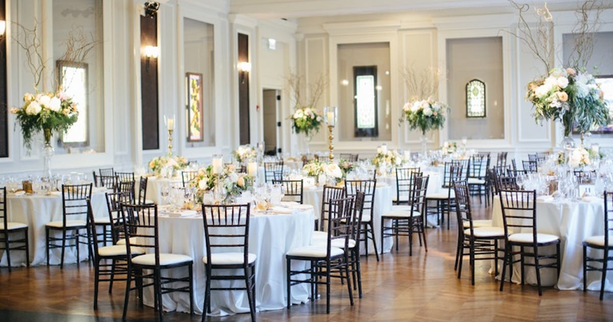 Elegant Robinson Gallery event space with floral centerpieces, ideal for weddings and gatherings.