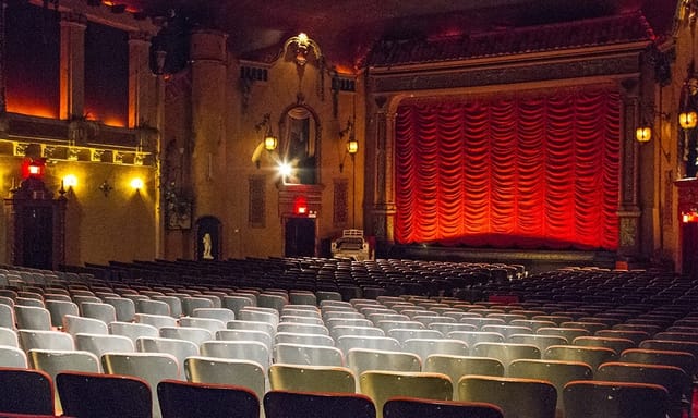 Classic Music Box Theatre with red curtain, ideal for elegant performances and events.