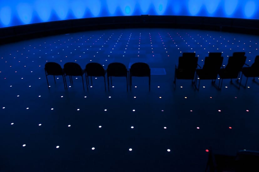 Grainger Sky Theater at Adler Planetarium, modern event space with blue lighting.