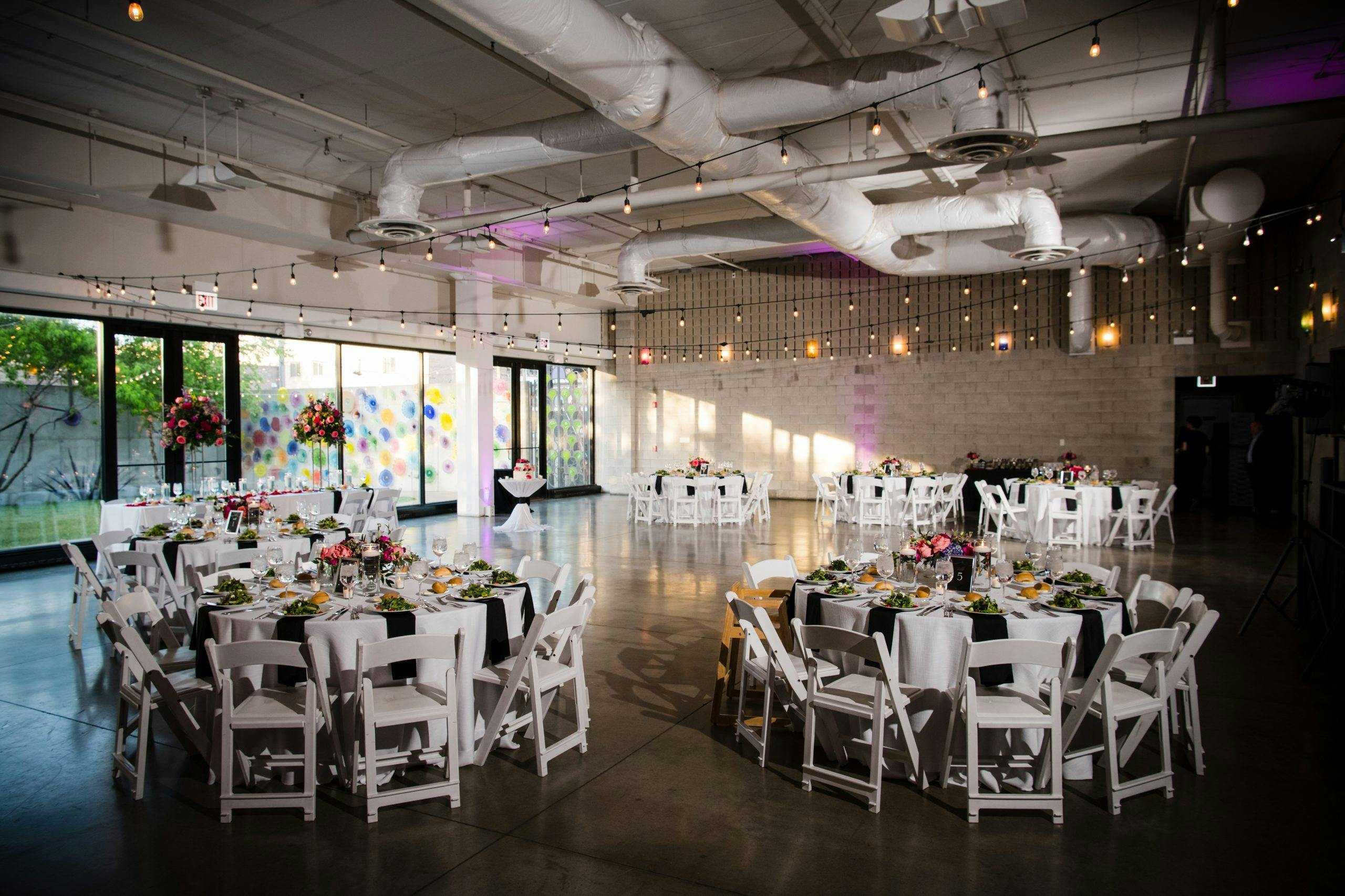 Elegant event space with floral centerpieces, perfect for galas and corporate gatherings.