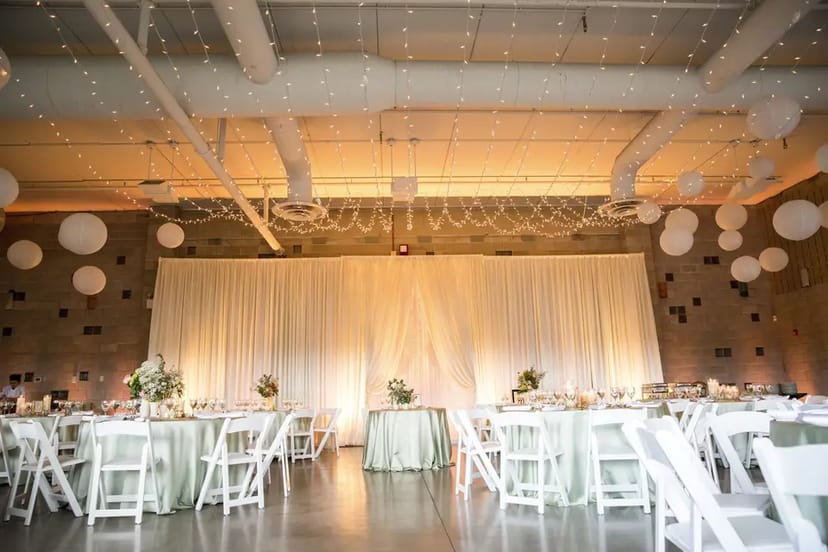 Elegant rooftop deck event space with soft lighting, ideal for weddings and gatherings.