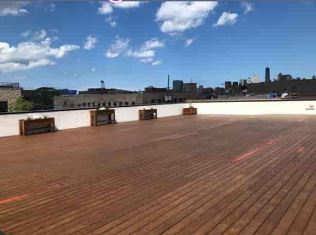 Rooftop deck at Ignite Glass Studios, ideal for outdoor events with city skyline views.