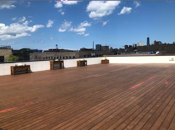 Rooftop deck at Ignite Glass Studios, ideal for outdoor events with city skyline views.