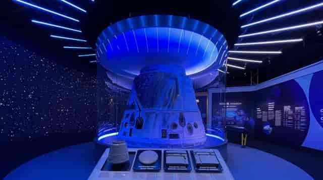 Futuristic Henry Crown Space Center with spacecraft model, ideal for aerospace events.