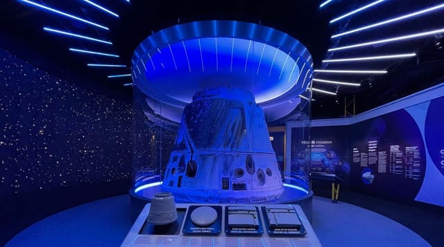 Futuristic Henry Crown Space Center with spacecraft model, ideal for aerospace events.