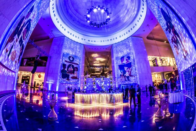 Rotunda at Griffin Museum, elegant event space with vibrant blue lighting for corporate gatherings.