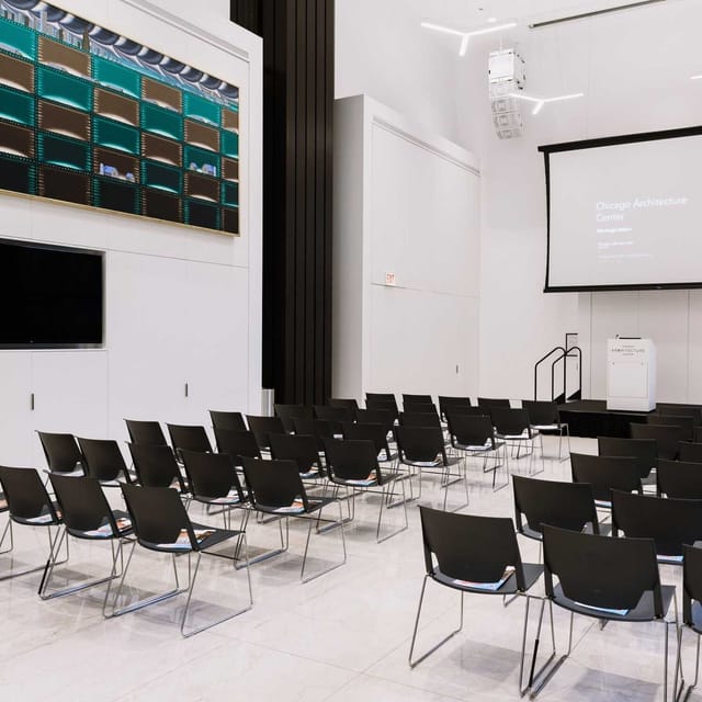 ArcelorMittal Design Studio event space with black chairs for presentations in Chicago.