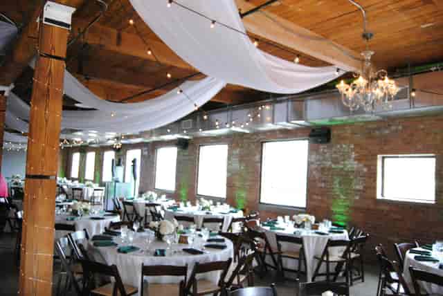 Elegant event space at The Dayton, featuring round tables for weddings and corporate gatherings.