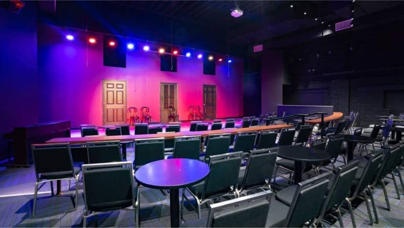 iO Theater classrooms with vibrant stage lighting for events, workshops, and performances.