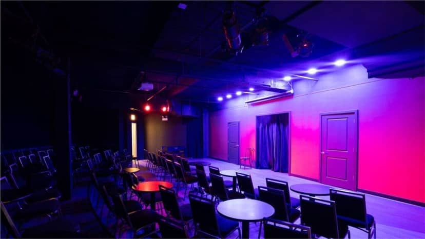 Comedy club at iO Theater with vibrant lighting, ideal for performances and events.