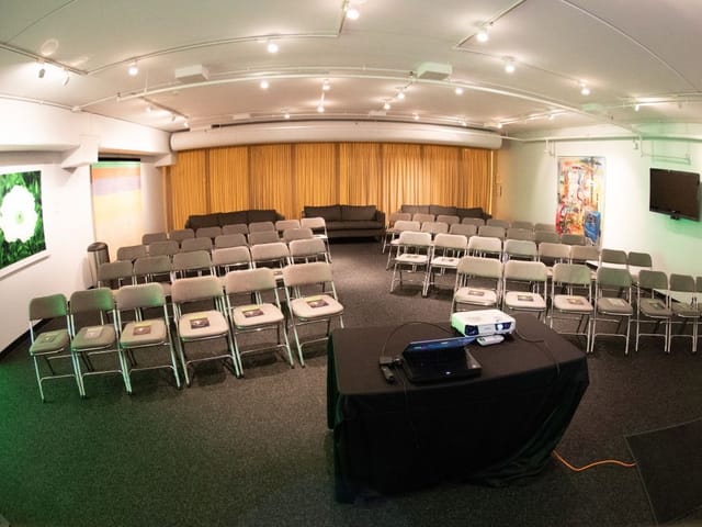 Harris Theater Lobby Level 2 with arranged chairs for engaging meetings or workshops.
