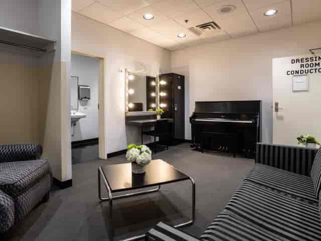 Donor Room at Harris Theater: elegant dressing room with piano for pre-event preparations.