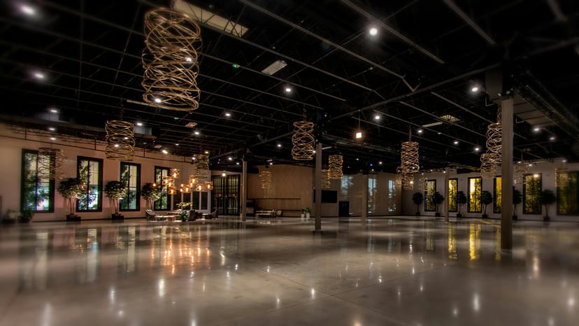 Spacious industrial-chic conference center with high ceilings for corporate events.
