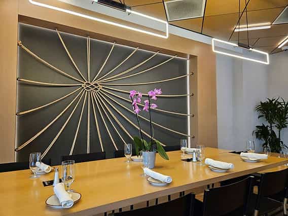 Modern dining space with elegant table setting for private events at Sonesta Meetings.