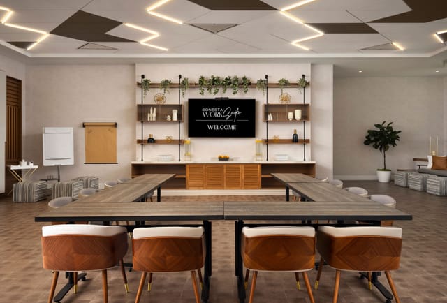Modern board room with large table, ideal for meetings and events.