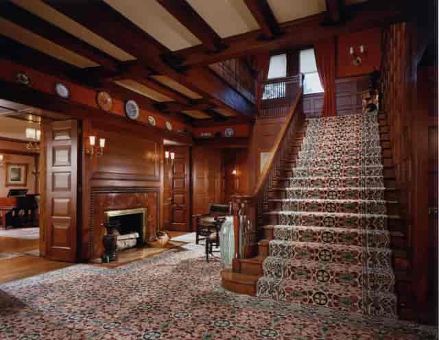 Elegant Glessner House foyer with wooden paneling, ideal for upscale events and receptions.
