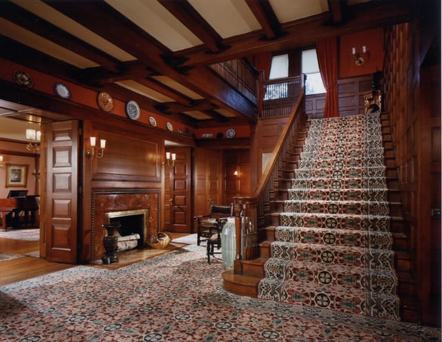 Elegant Glessner House foyer with wooden paneling, ideal for upscale events and receptions.