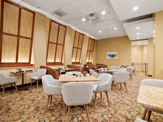 Conference center at Crowne Plaza Houston with stylish seating for networking events.