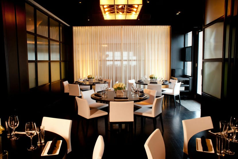 Sophisticated dining space with round tables for intimate events at RPM Italian Chicago.