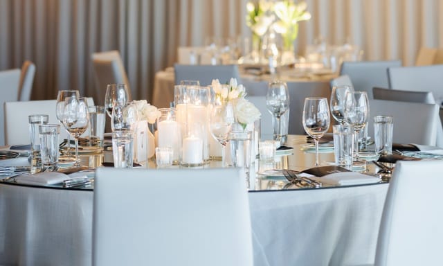 Elegant dining table with floral centerpieces for weddings or corporate events in RPM Italian.