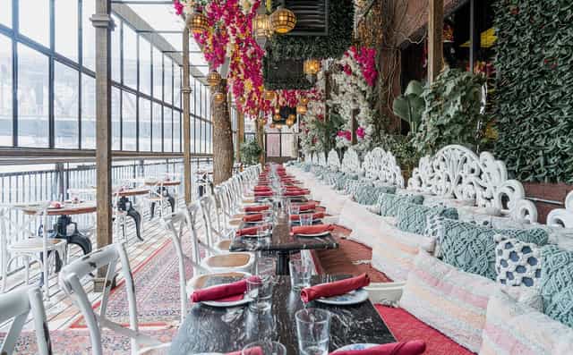 Elegant event space with floral decor for private dining and gatherings at Beatnik On The River.