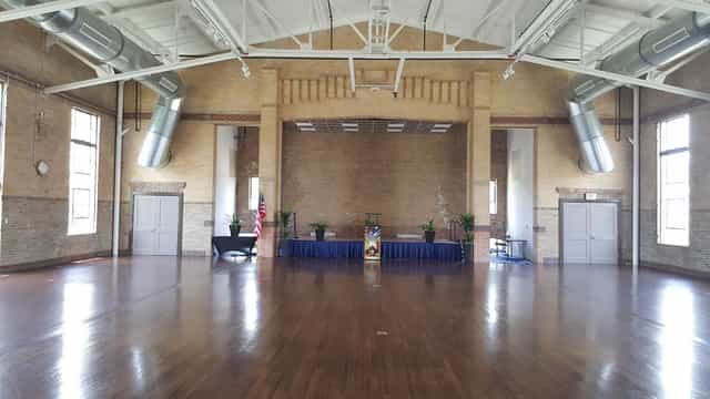 Spacious Officer's Club venue with high ceilings for events and ceremonies at Buffalo Soldiers Museum.