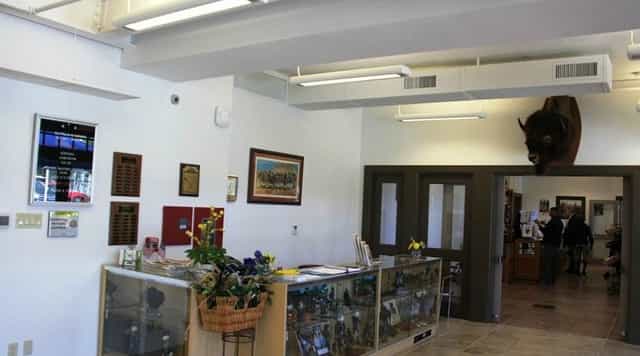 Officer's Club at Buffalo Soldiers Museum with bison head, ideal for events and gatherings.