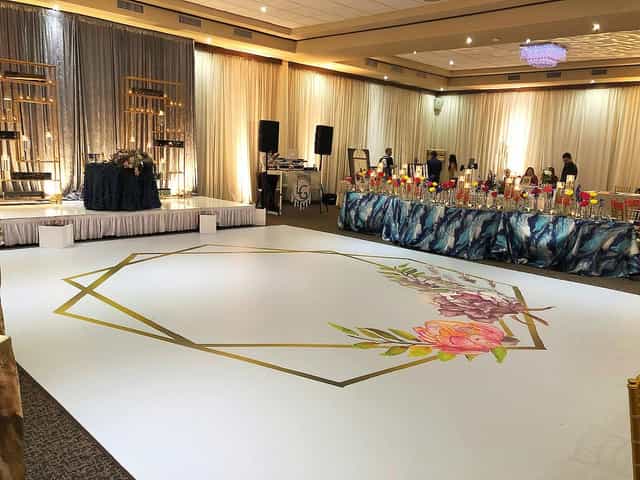 Elegant event space with floral accents, ideal for weddings and upscale gatherings.