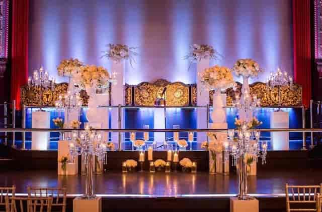 Elegant banquet hall with floral arrangements, ideal for ceremonies and galas.