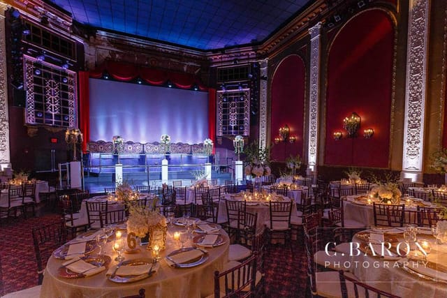 Elegant banquet hall with round tables, ideal for weddings and galas at The Majestic Metro.