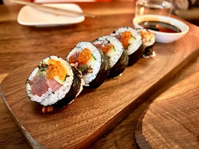 Private dining room with vibrant sushi platter for upscale events and catering.