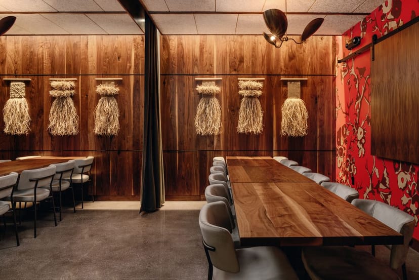 Private dining room with wooden table, ideal for corporate meetings and workshops.