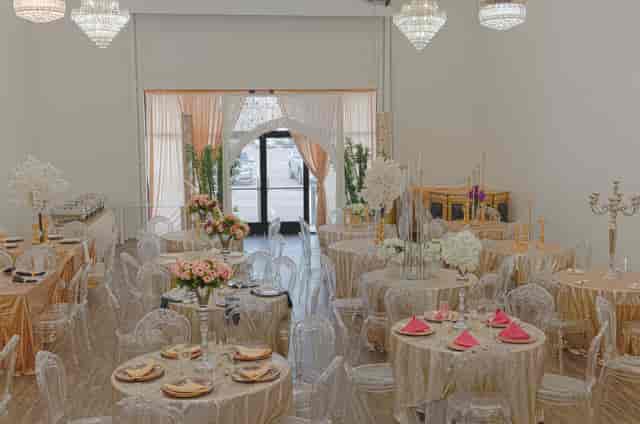 Luxury Occasion Event Hall with gold tables and elegant decor for weddings and upscale events.