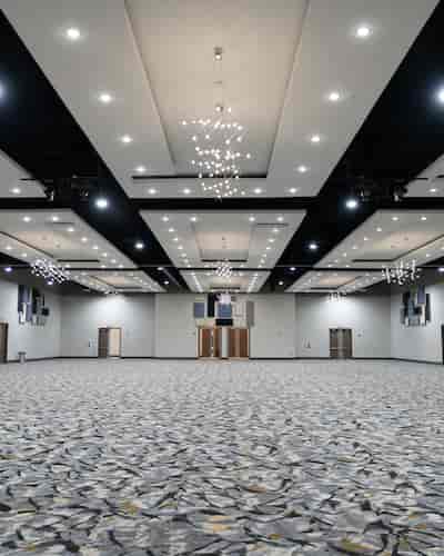 Civic Center at LOEH: spacious event hall with modern chandeliers for conferences and banquets.