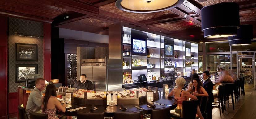 Post Oak Room at Willie G's: stylish bar with ambient lighting for networking events.