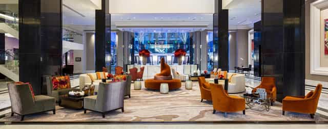 Post Oak Room at Willie G's: modern hotel lobby with vibrant decor for events and meetings.