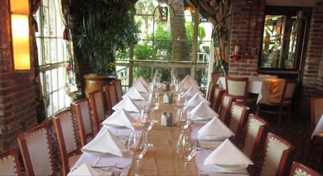 Banquet Room at Pappadeaux Seafood Kitchen, elegant table setup for corporate dinner events.