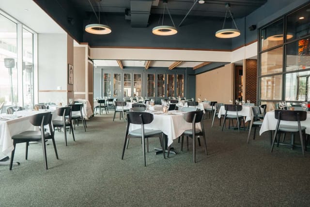 Private Events Area at Masraff's with elegant tables for gatherings and networking.