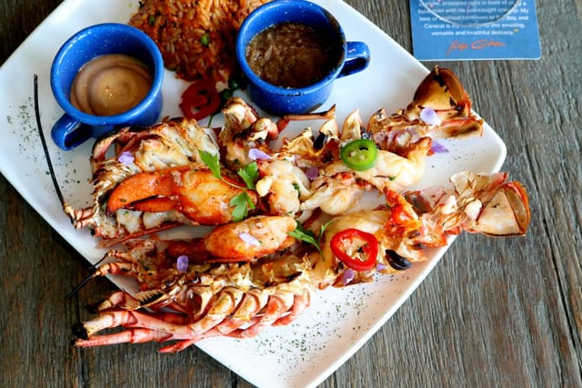 Grilled lobster dish with sauces at Marea, Caracol for upscale event catering.