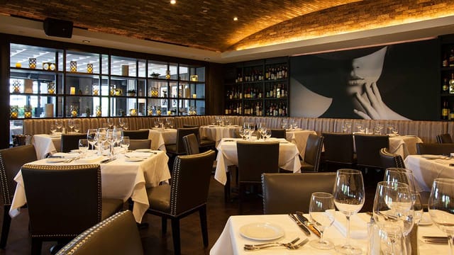 Elegant West Terrace Dining Room at Steak 48, perfect for upscale events and gatherings.