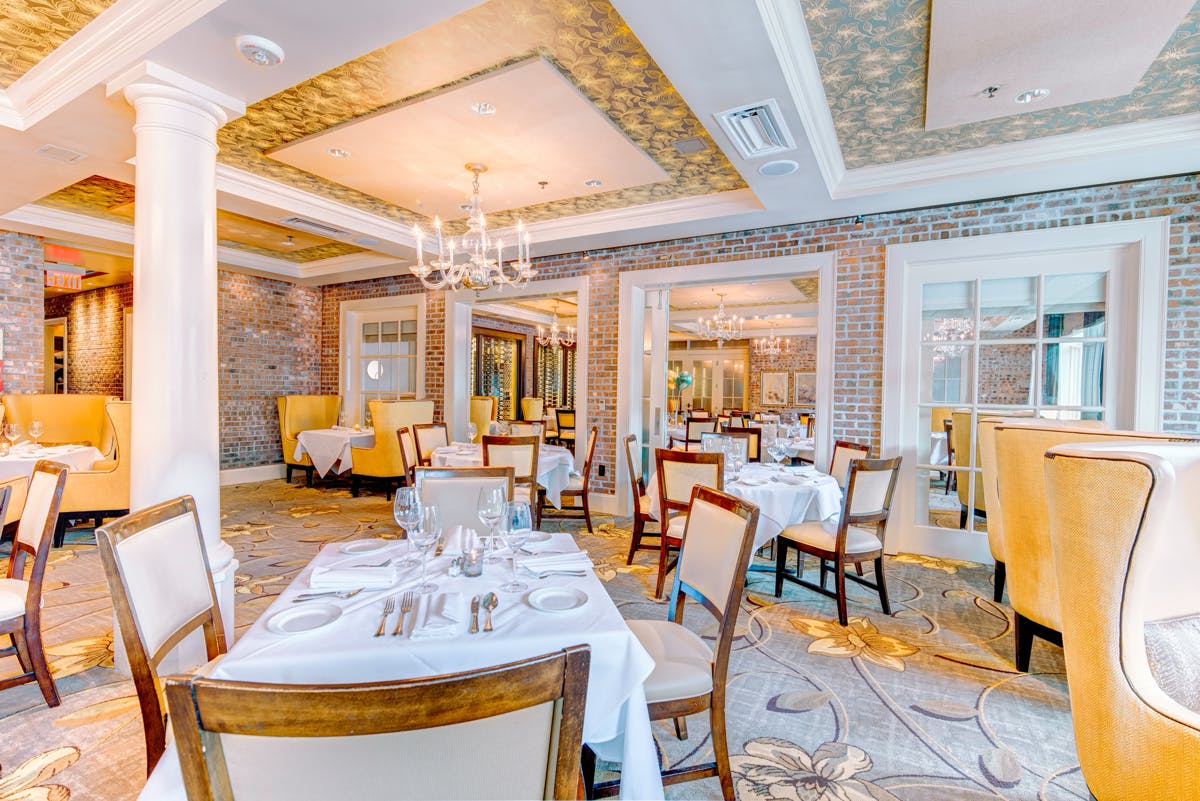 Elegant Solarium dining space at Brennan's of Houston, perfect for upscale events and meetings.