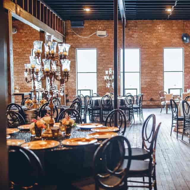 Private dining room at Brennan's of Houston with elegant tables for upscale events.
