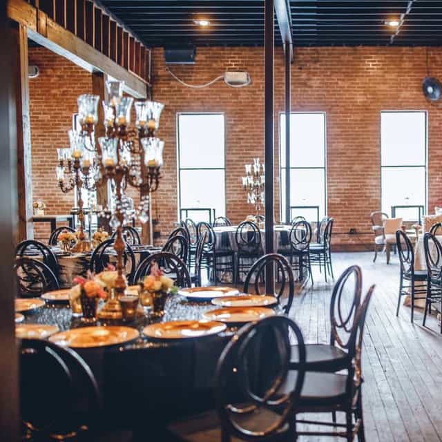 Private dining room at Brennan's of Houston with elegant tables for upscale events.